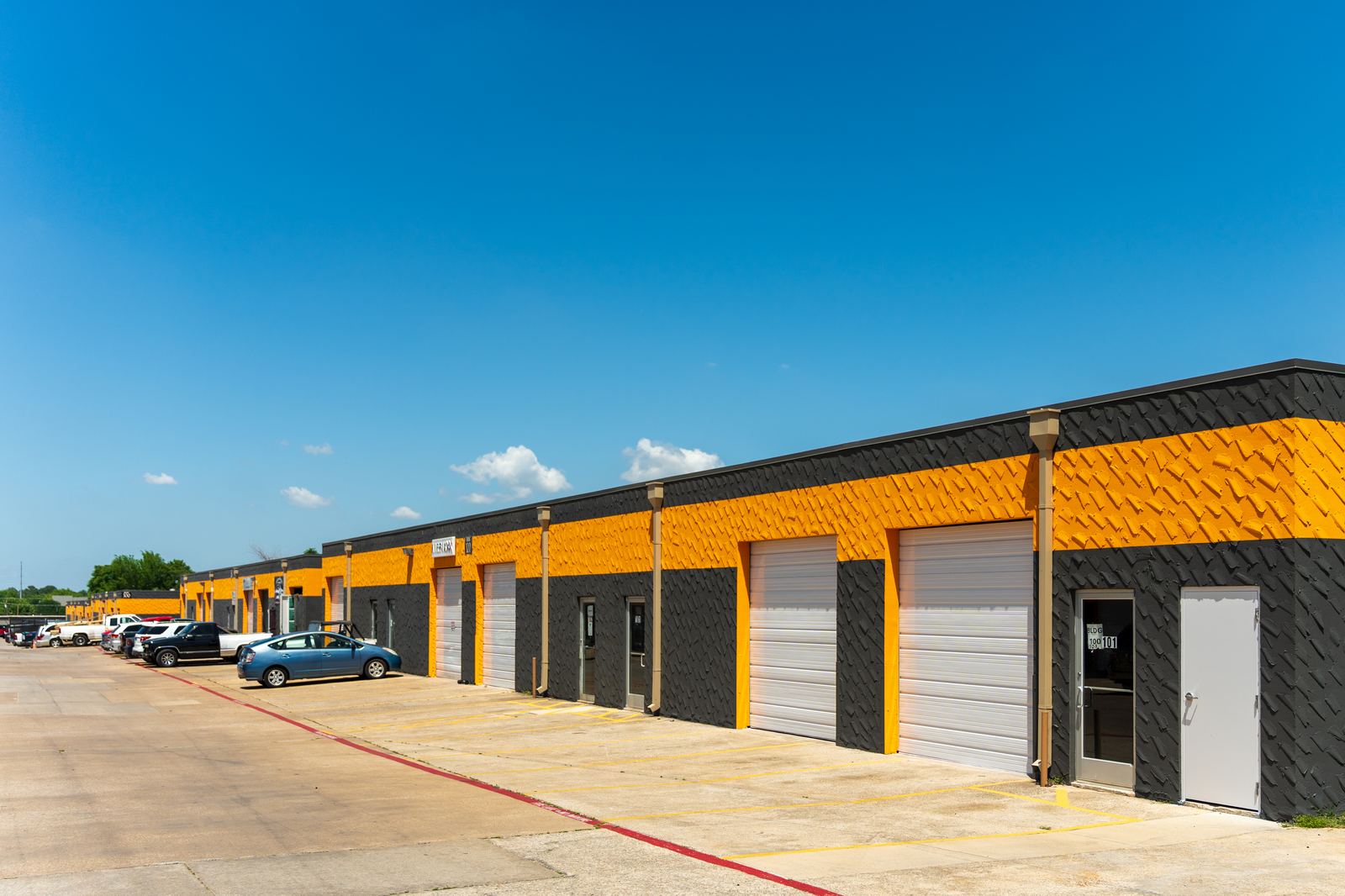 Row of Exchange tenant suites with parking out front